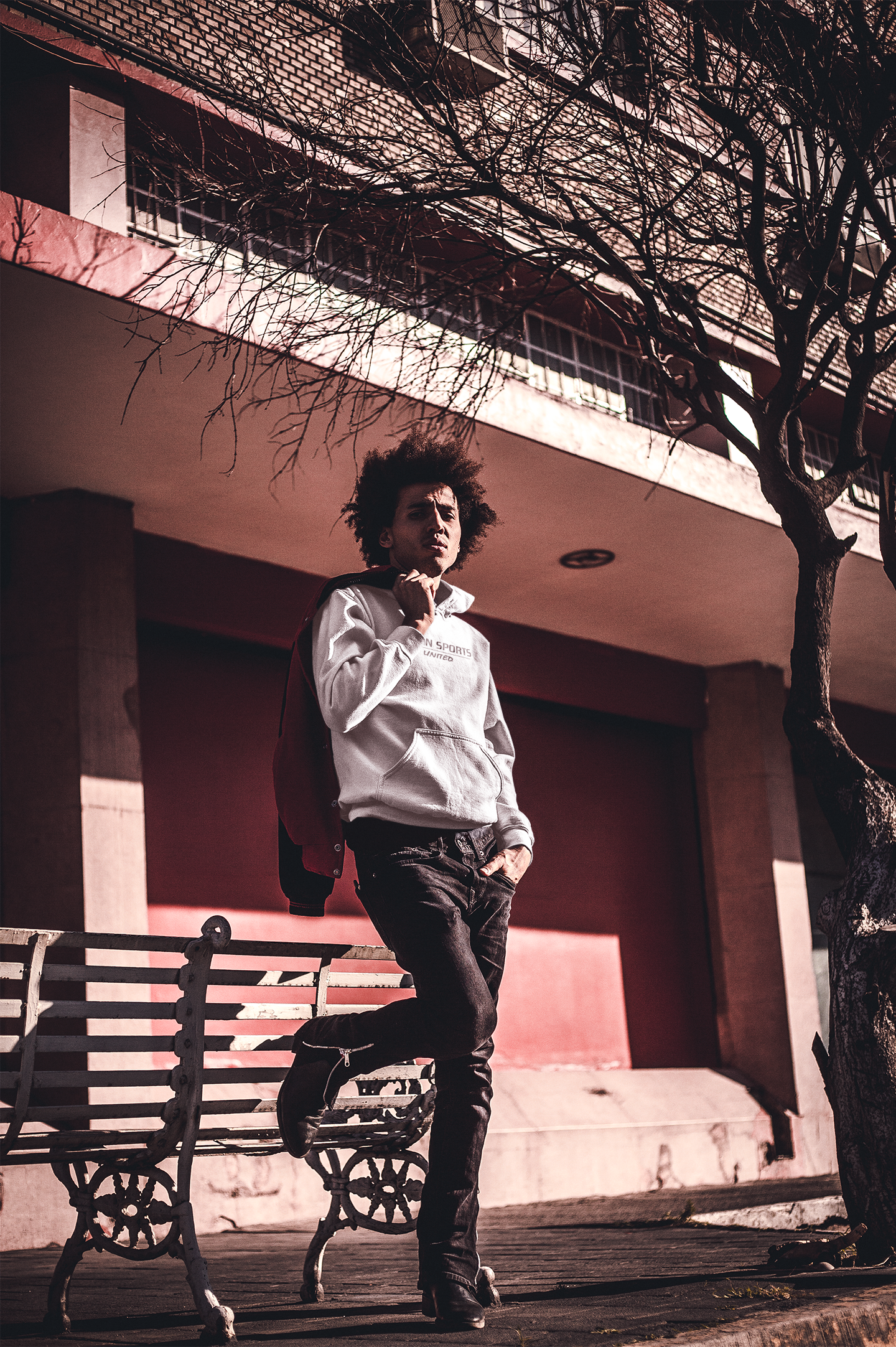 dude-with-an-afro-wearing-a-pullover-hoodie-mockup-on-the-street-a18945