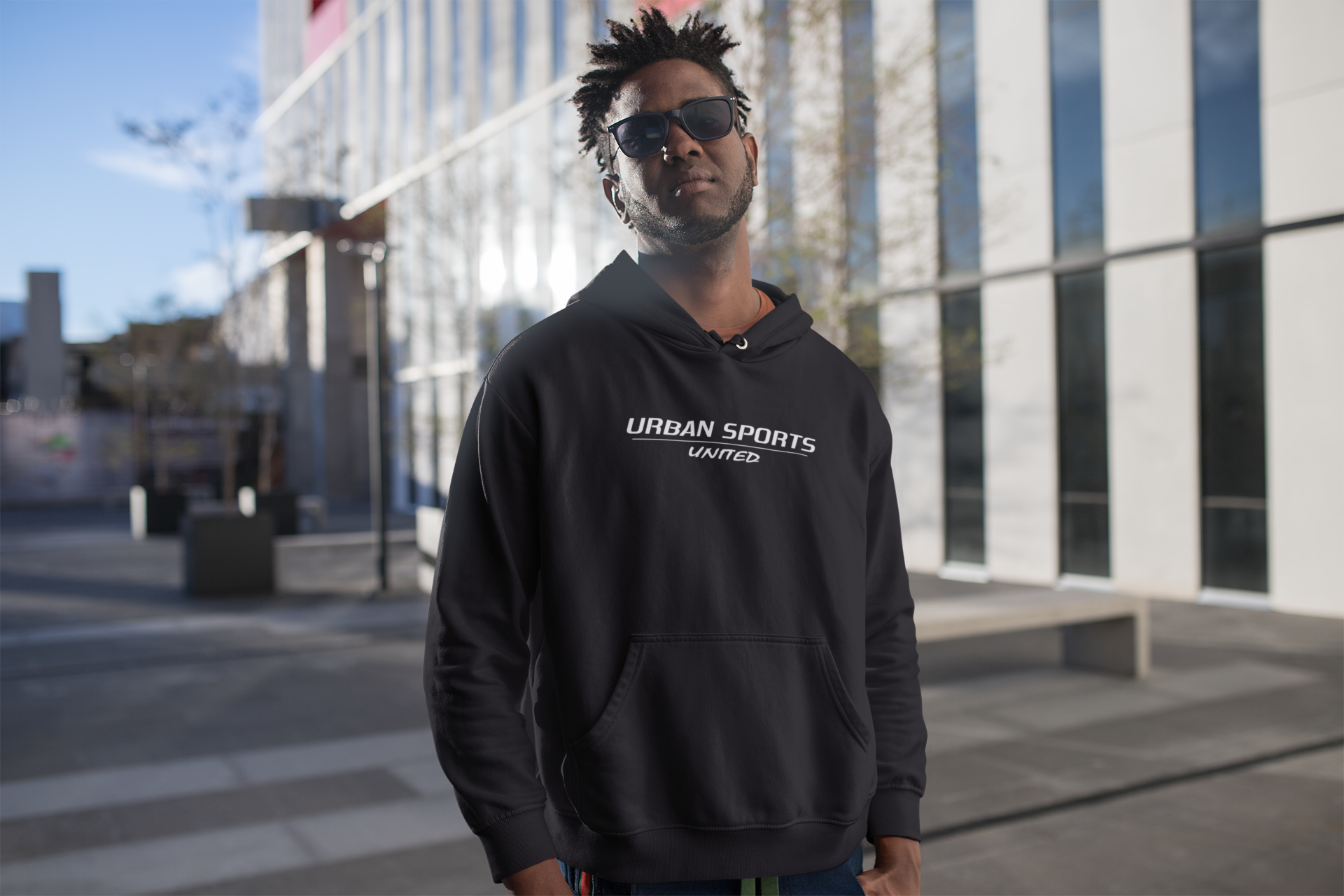 hoodie-mockup-featuring-a-man-outside-a-city-building-24317