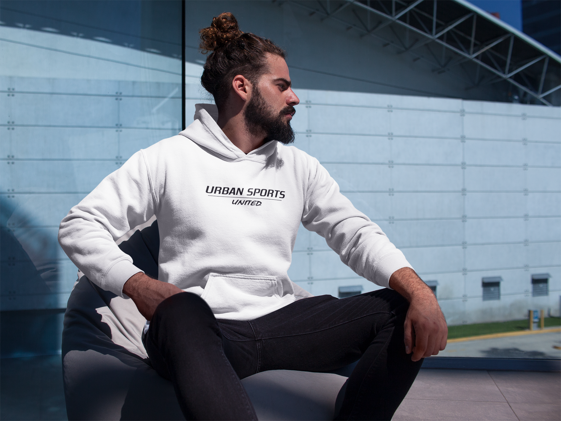 man-wearing-a-pullover-hoodie-mockup-near-a-building-a17764