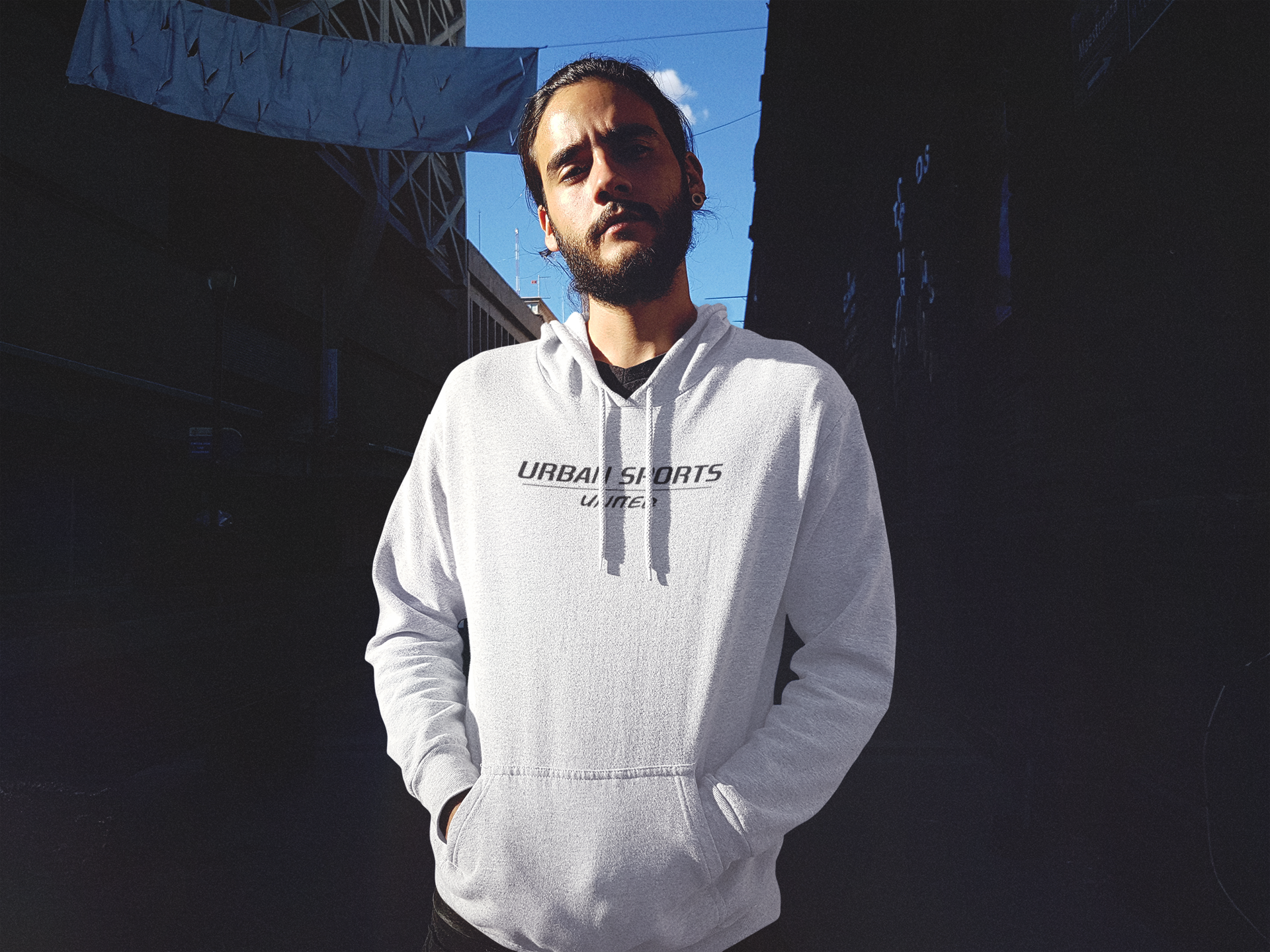 serious-hipster-guy-with-a-beard-wearing-a-pullover-hoodie-mockup-in-an-alley-b12620